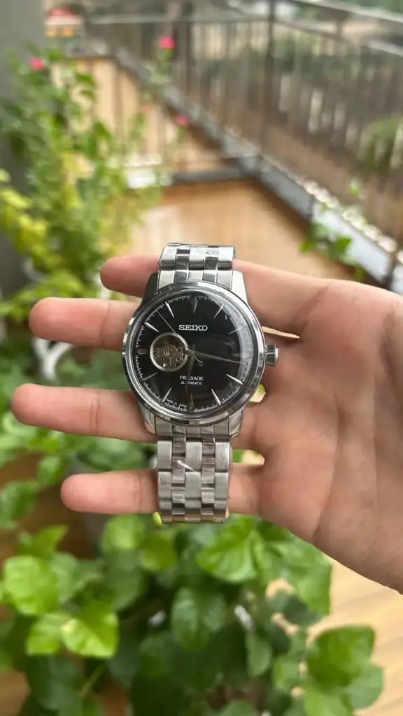 Classic Black Dial Automatic Watch with Open Heart and Steel Bracelet